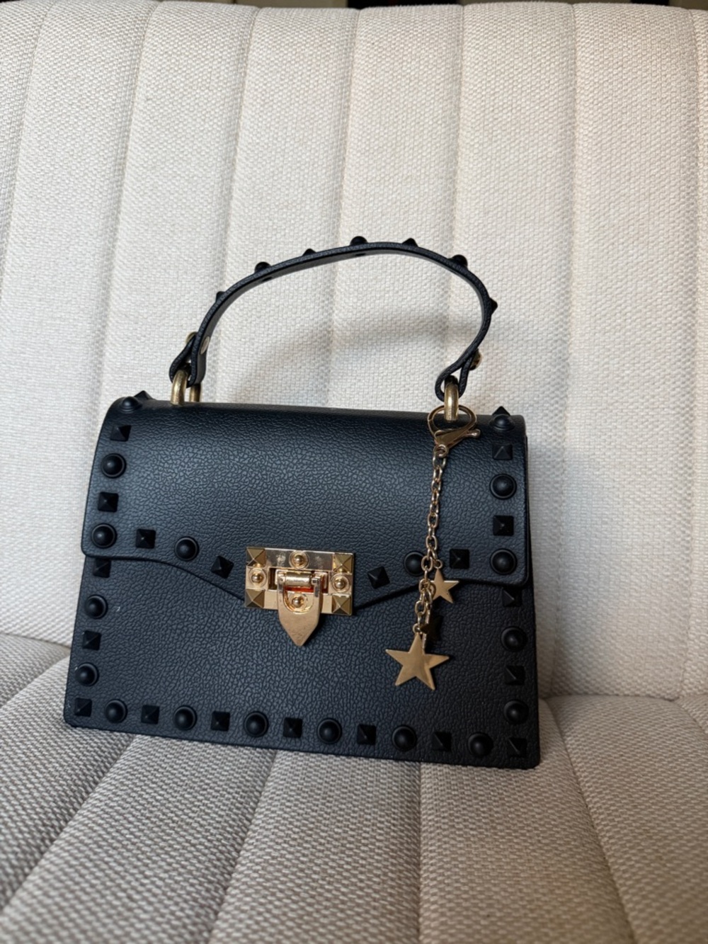 Elegant Black Studded Top-Handle Bag with Gold Star Charm